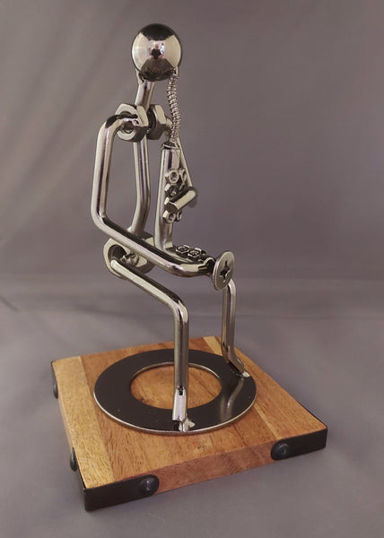 Silver Saxophone Player Figurine